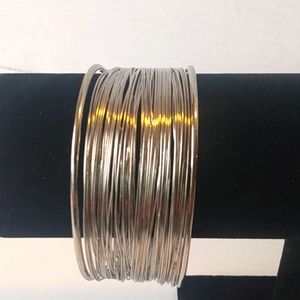 Silver women's multi string cuff bracelet